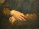 Detail of Lisa`s hands, her right hand resting on her left. Leonardo chose this gesture rather than a wedding ring to depict Lisa as a virtuous woman and faithful wife